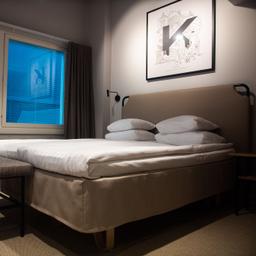A modern bedroom, featuring a double bed, at Original Sokos Hotel Wiklund in Turku.